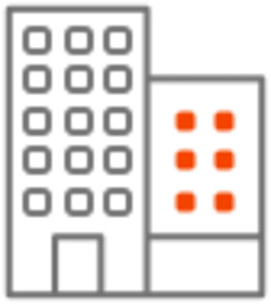 A simple, stylized floor plan of a building showing a larger multi-story structure on the left and a smaller section on the right with distinct boxes that may represent rooms or units. Red elements highlight specific features or areas of interest, suggesting a conceptual design rather than a realistic layout.